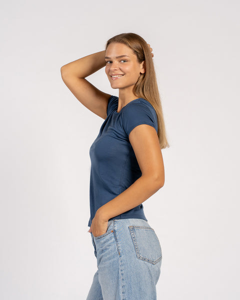 Side view of model wearing denim Merino T-shirt – soft lightweight wool tee