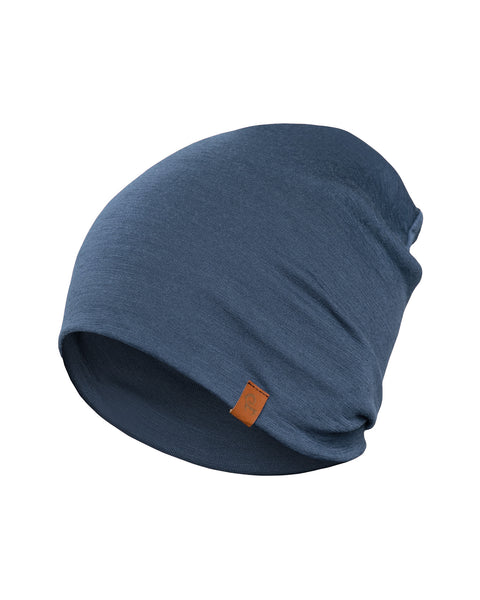 The menique Men's Merino Beanie in color Denim, white background.