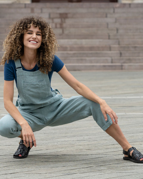 Gorgeous woman in a city, wearing mint green linen Jumpsuit Nicci.