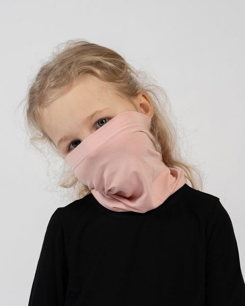 Kids merino wool neck gaiter in pink – warm, stretchable face and neck protection for cold weather