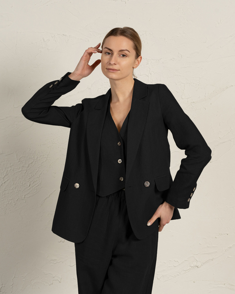 Classic black linen blazer Quin with notch lapels and flap pockets shown in elegant professional styling by menique
