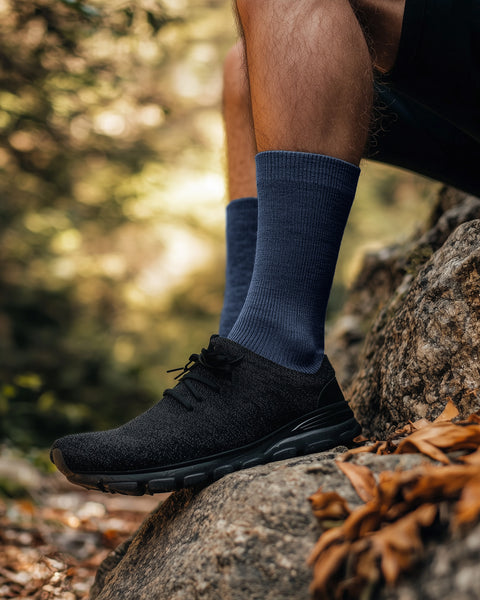 Men’s thin Merino wool crew socks in blue color, lightweight, odor-resistant, and soft for all-day wear.