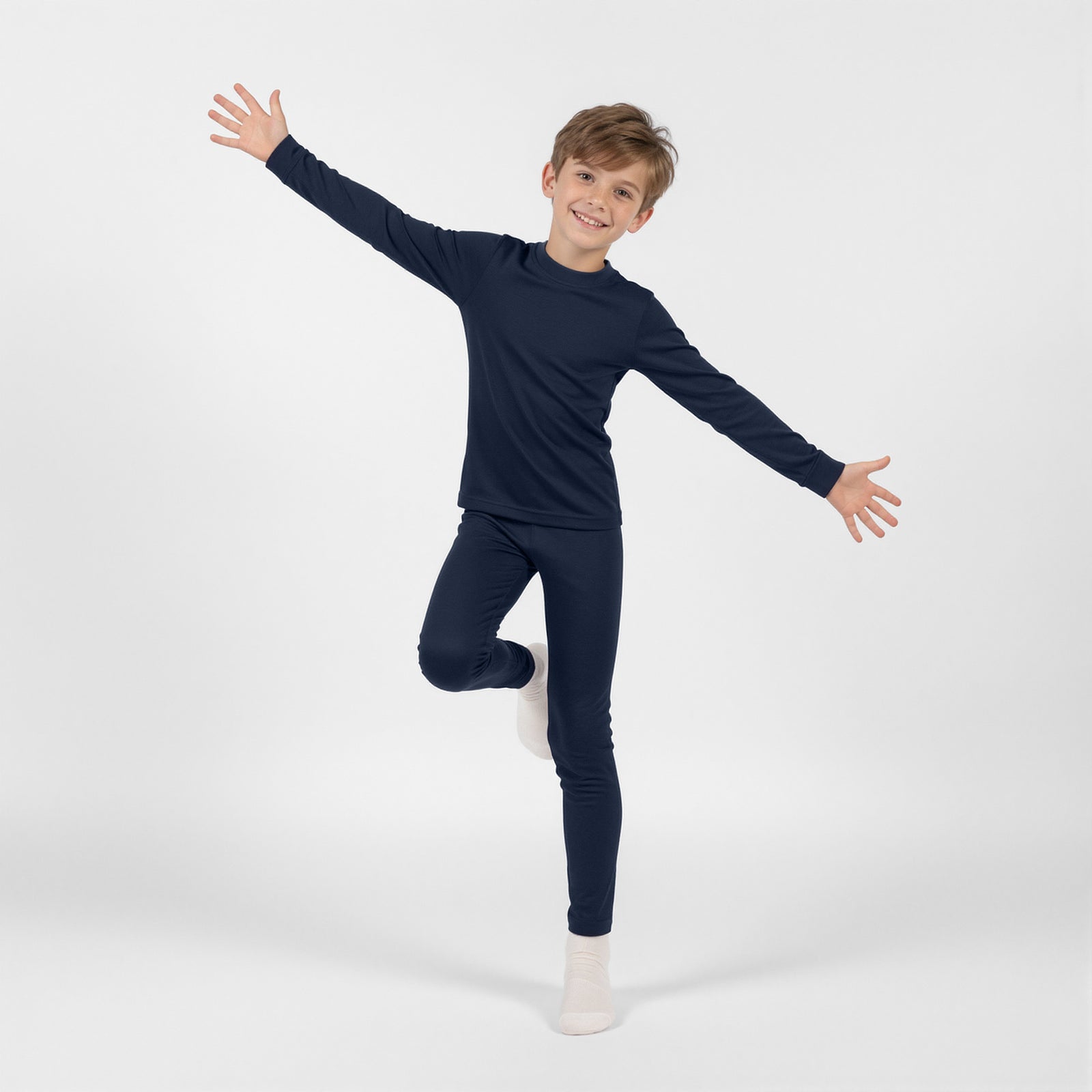 A person modeling navy blue thermal leggings and light-colored socks, shown from the waist down.